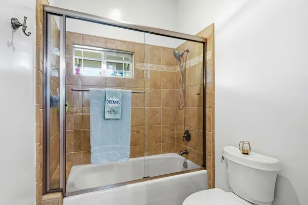 a kitchen with a sink stove and refrigerator