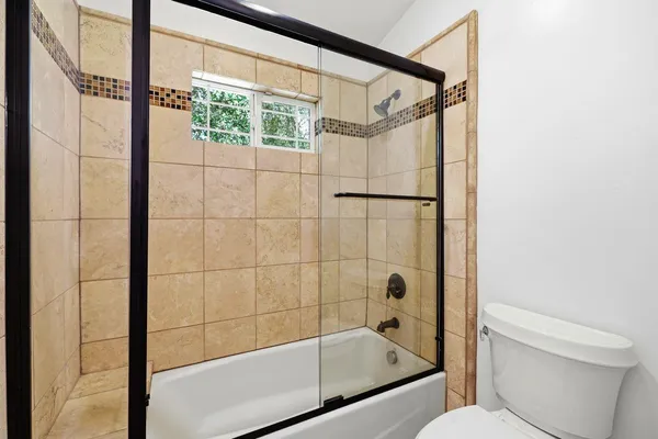 a bath tub sitting next to a window