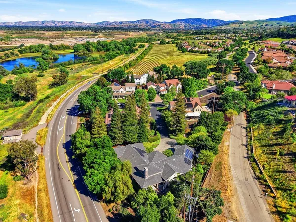 an aerial view of residential houses with outdoor space
