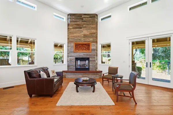 a living room with furniture and a fireplace