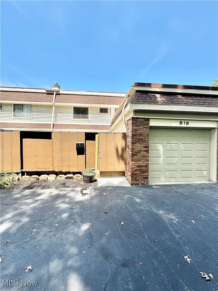 7050 Chillicothe Road, Unit B18 Mentor, OH 44060 - Photo 21 of 24 View of front of home with brick siding and a garage