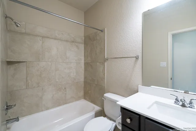 a view of an empty room with a kitchen