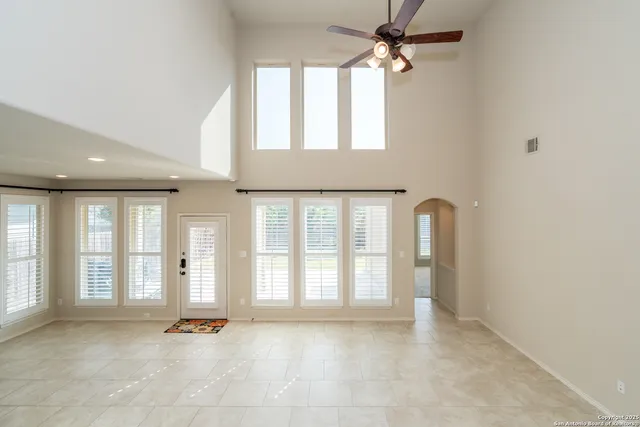 a bathroom with a granite countertop sink a toilet and shower