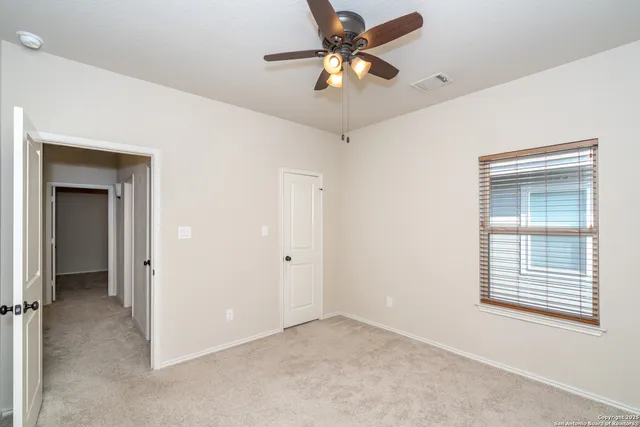 a view of a kitchen with furniture and stairs