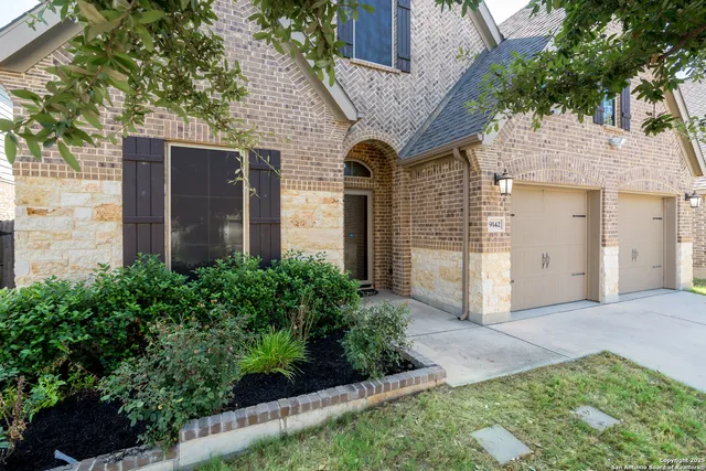 a front view of a house with garden