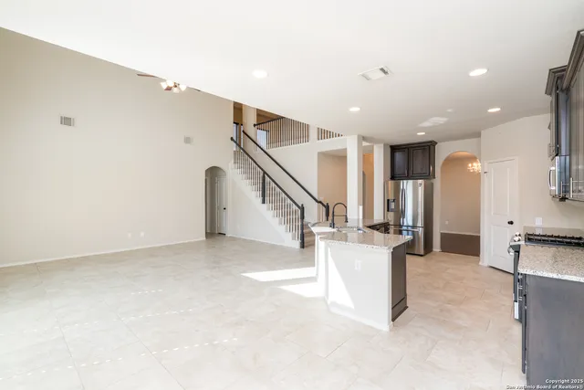 a view of entryway and hall with a dining table