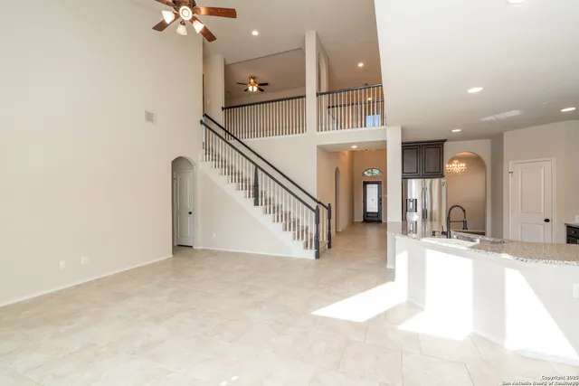 a bathroom with a tub sink shower and mirror