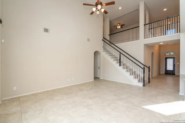 a bathroom with a tub a sink and a large mirror