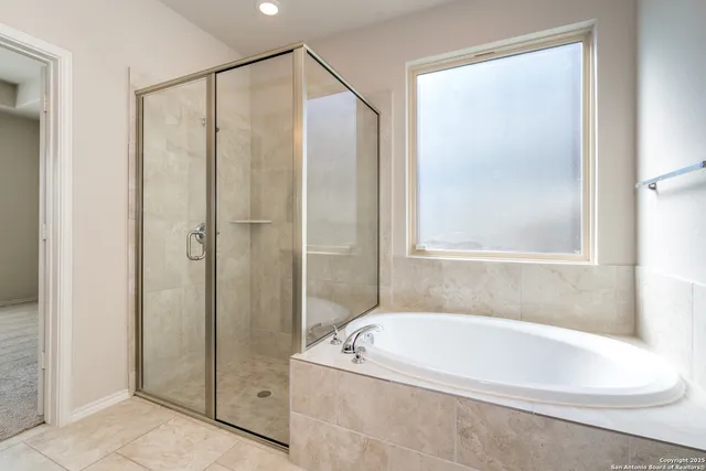 a view of a backyard with sitting area