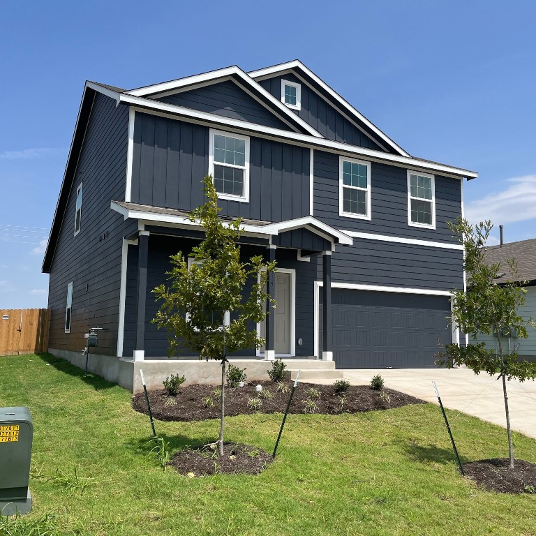 a front view of a house with a yard table and chairs