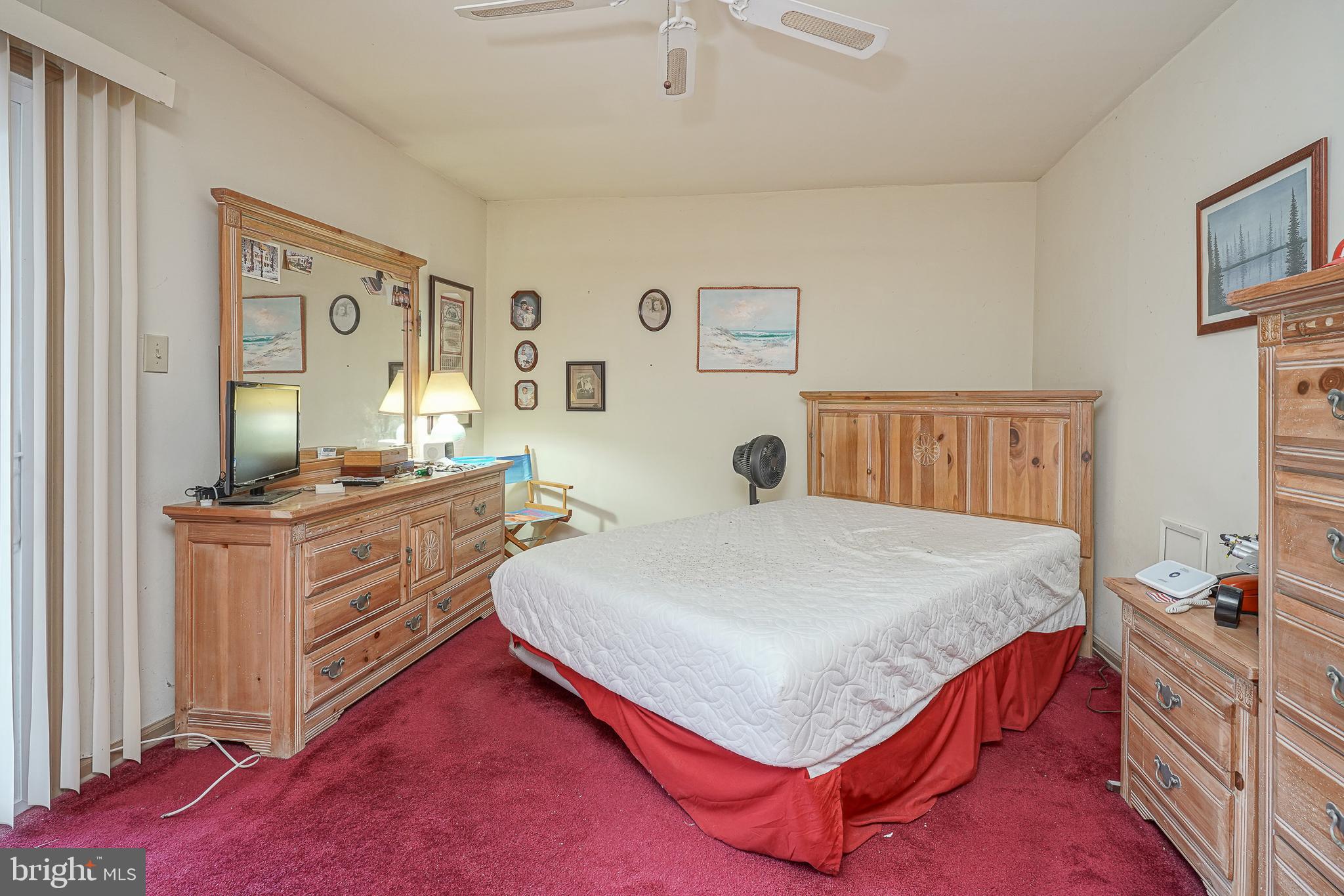 40 Tansboro Road, Unit 7B Berlin, NJ 08009 - Photo 14 of 20 a bedroom with a bed and wooden floor