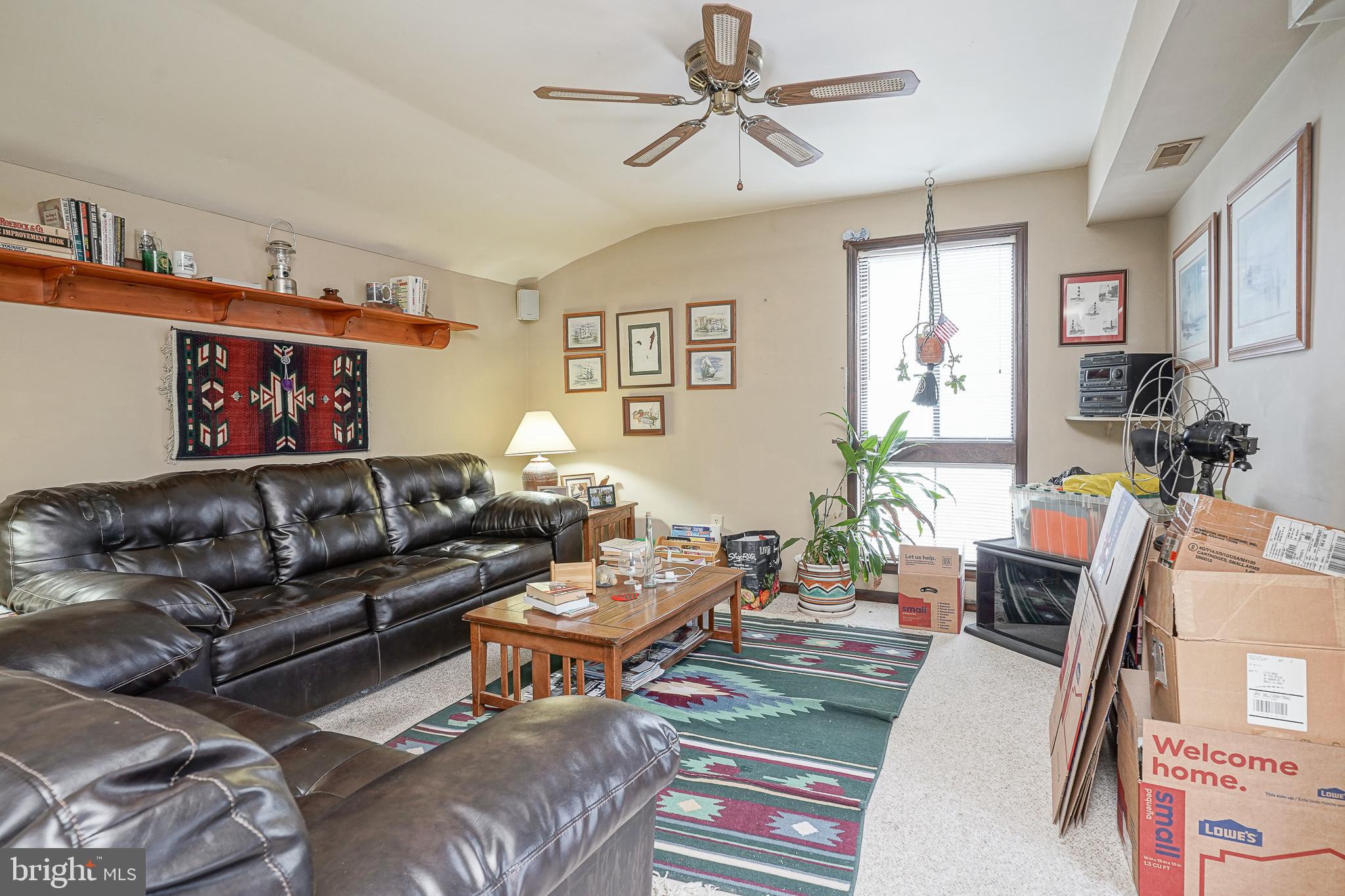 40 Tansboro Road, Unit 7B Berlin, NJ 08009 - Photo 5 of 20 a living room with furniture ceiling fan and a window