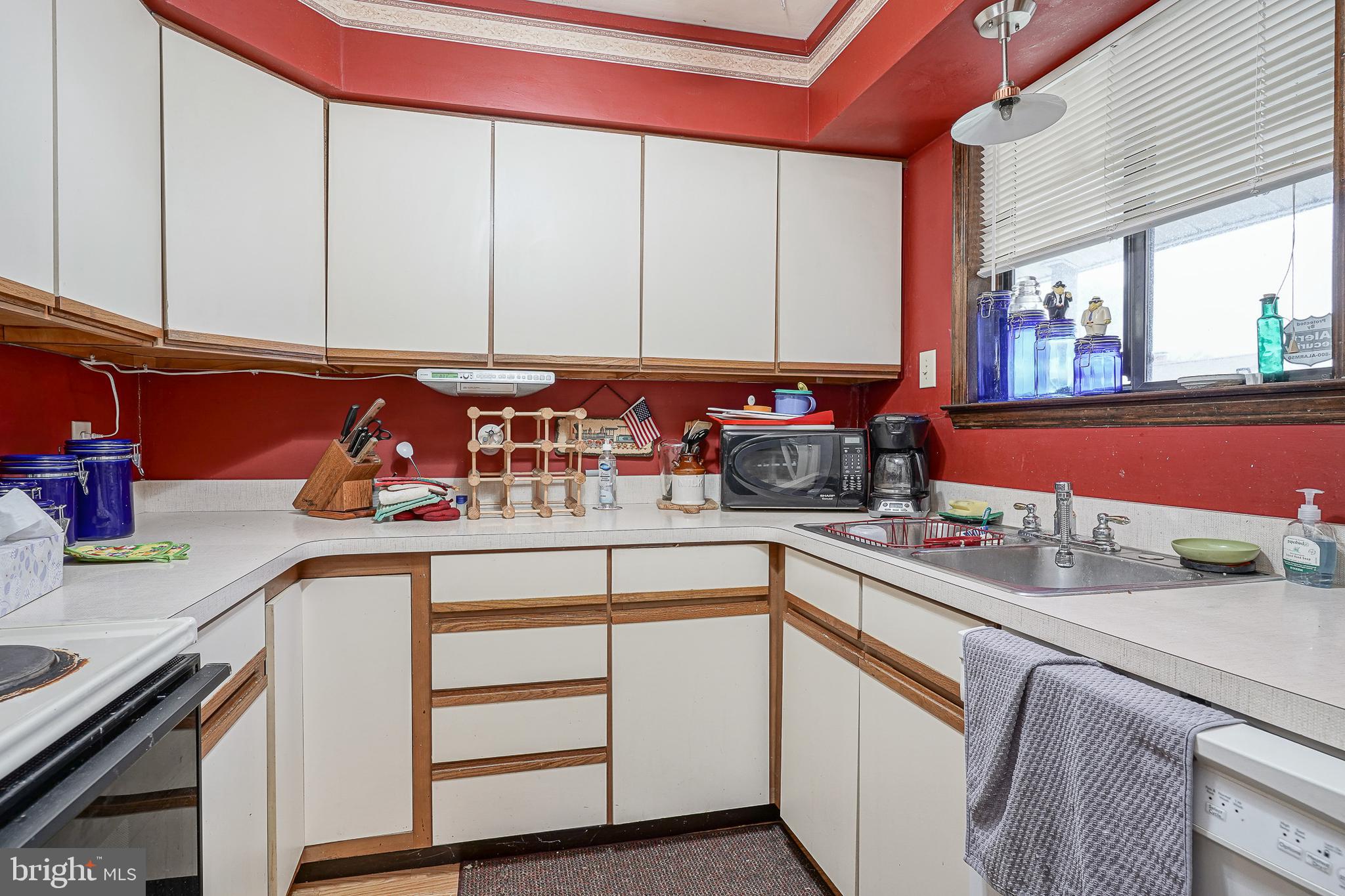 40 Tansboro Road, Unit 7B Berlin, NJ 08009 - Photo 8 of 20 a kitchen with stainless steel appliances granite countertop a sink stove and cabinets