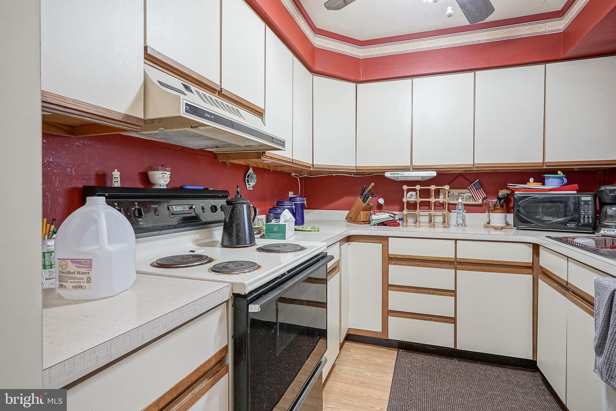 40 Tansboro Road, Unit 7B Berlin, NJ 08009 - Photo 10 of 20 a kitchen with a sink cabinets and appliances