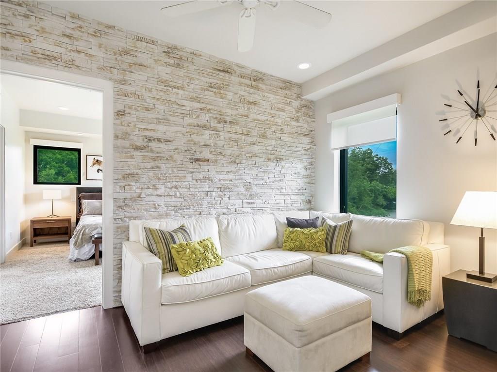 1603 Enfield Road, Unit 200 Austin, TX 78703 - Photo 11 of 27 a living room with furniture and a large window