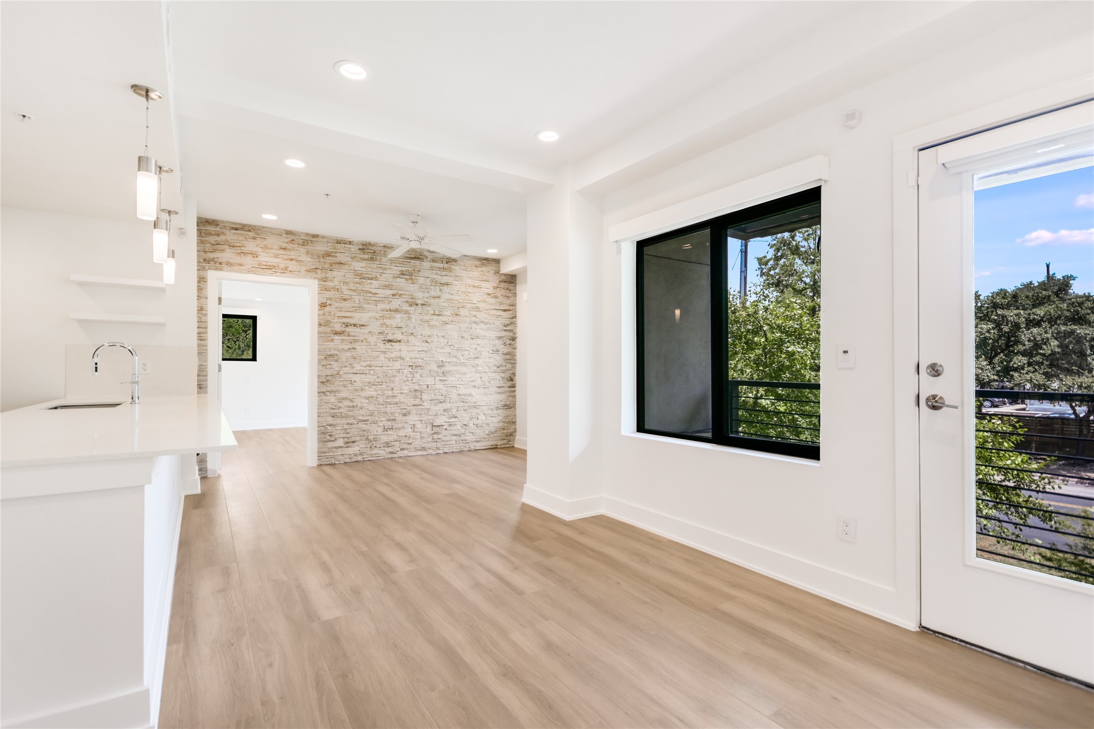 1603 Enfield Road, Unit 200 Austin, TX 78703 - Photo 12 of 27 a view of an empty room with wooden floor and a window