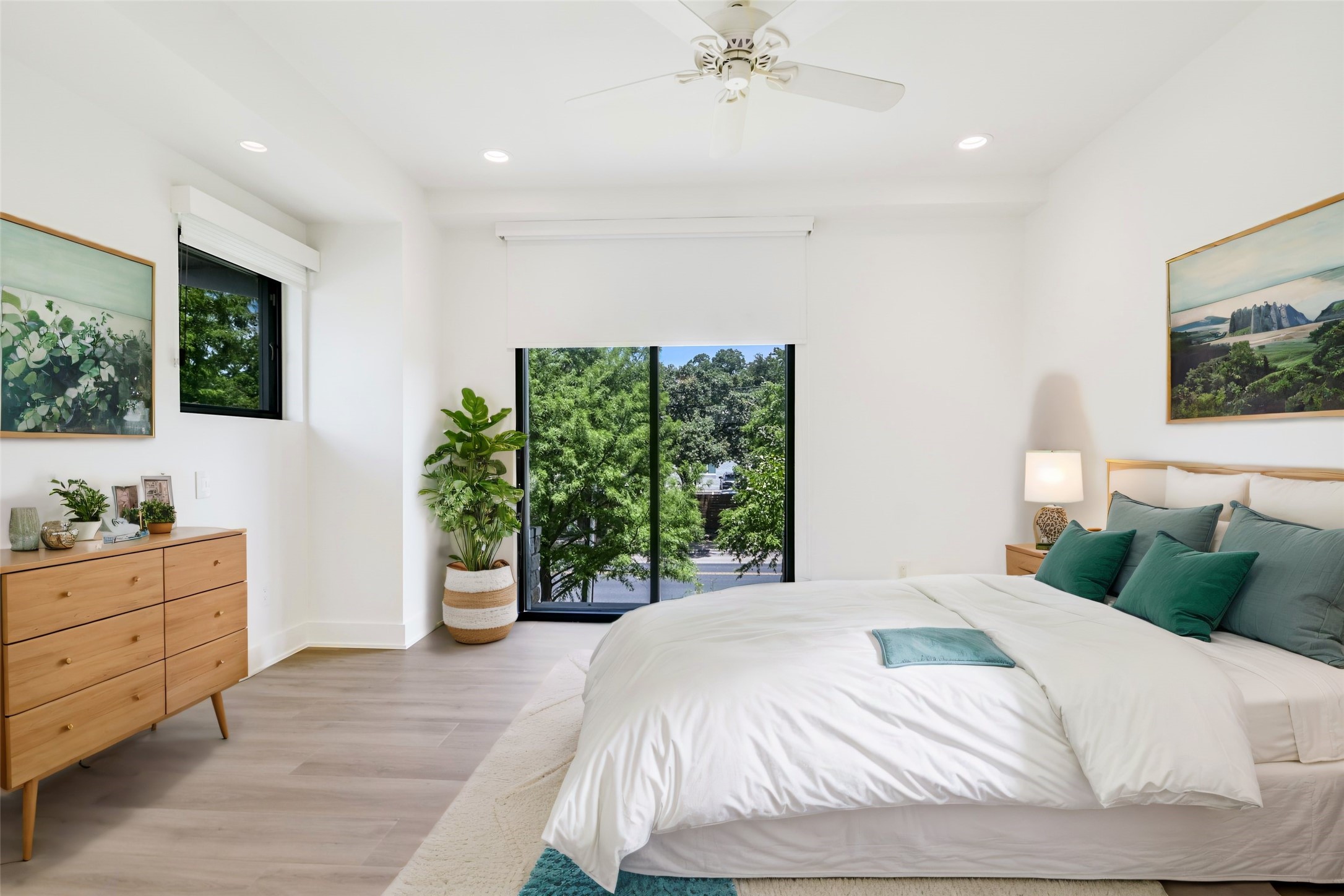 1603 Enfield Road, Unit 200 Austin, TX 78703 - Photo 16 of 27 a bedroom with a large bed and a flat screen tv