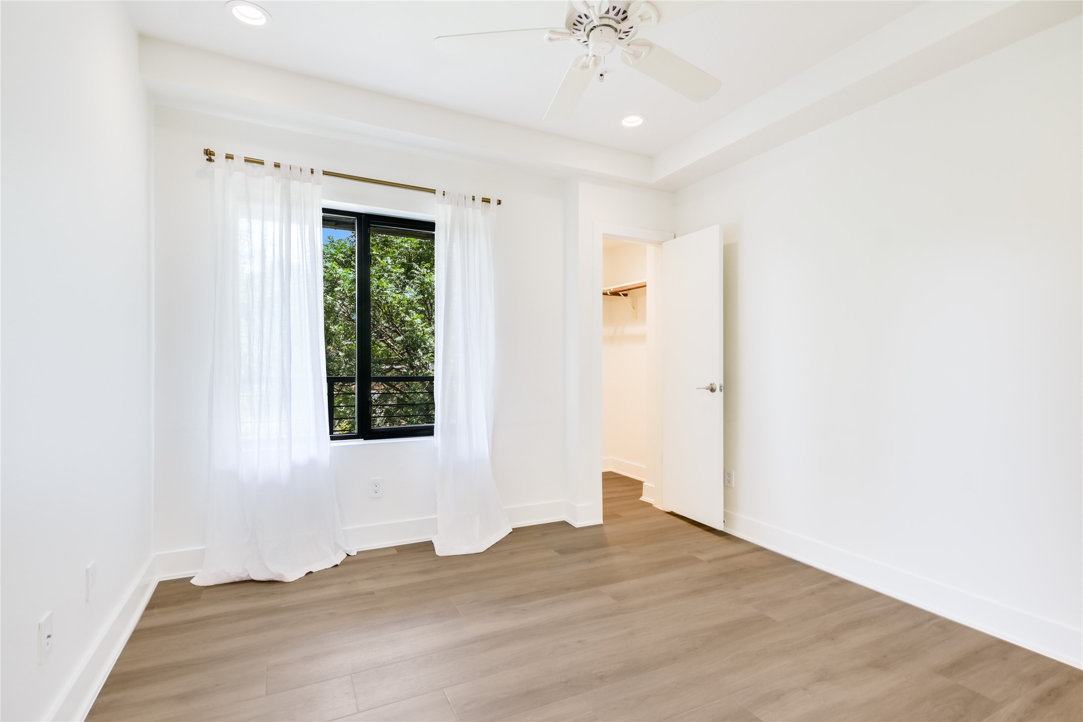 1603 Enfield Road, Unit 200 Austin, TX 78703 - Photo 18 of 27 a view of an empty room with a window