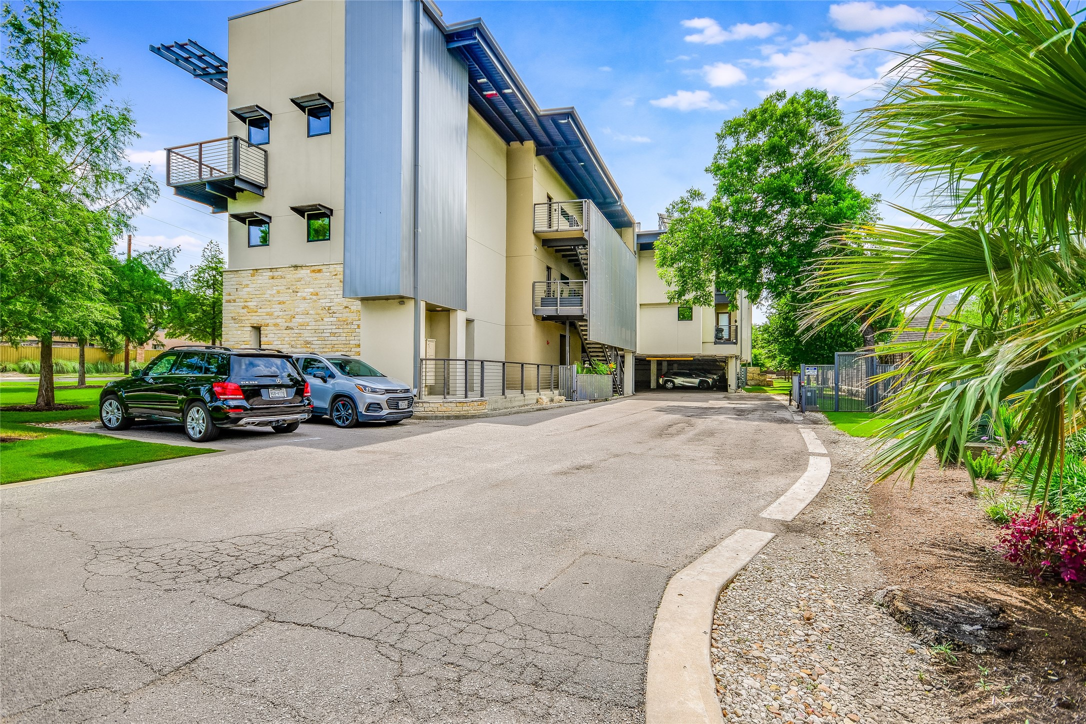 1603 Enfield Road, Unit 200 Austin, TX 78703 - Photo 21 of 27 a building with trees in front of it