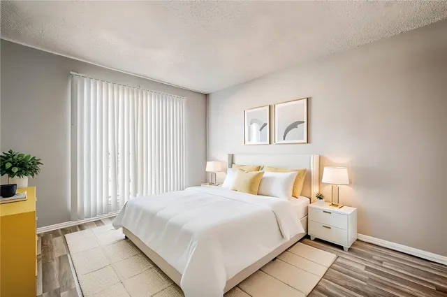 a large white bed in a white room