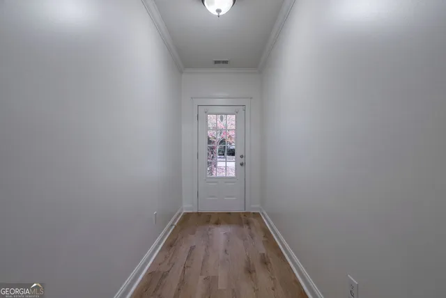 a living room with furniture wooden floor and a fireplace