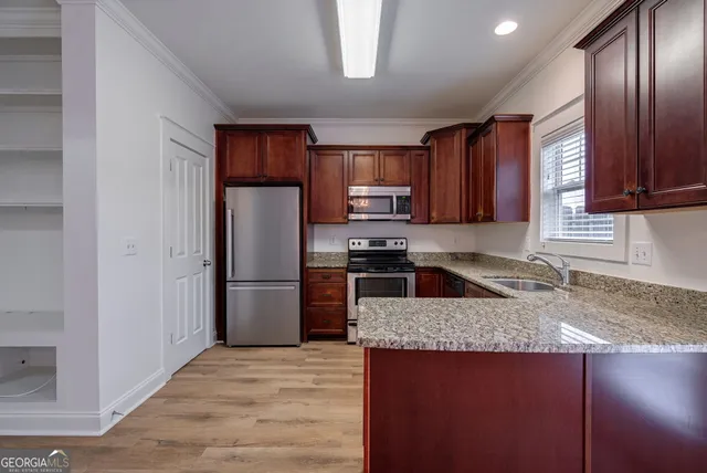 a view of a livingroom with a chandelier fan