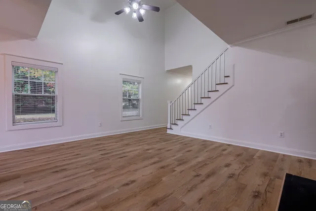 a living room with furniture and flat screen tv