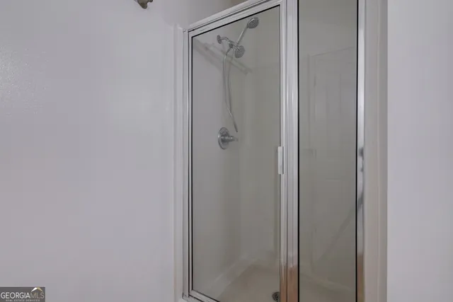 a view of a patio with couches table and chairs and potted plants