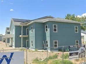 215 Northwest 11th Street Hermiston, OR 97838 - Photo 4 of 8 a front view of a house with garden
