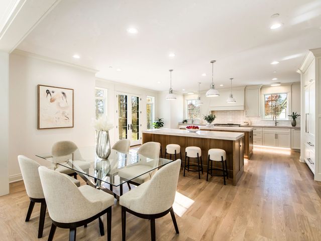 a living room with furniture a dining table and kitchen view