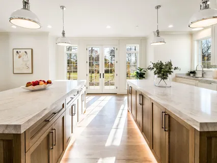 a kitchen with a sink a stove and a wooden floors