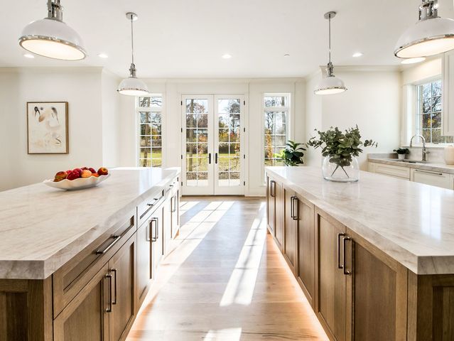 a kitchen with a sink a stove and a wooden floors