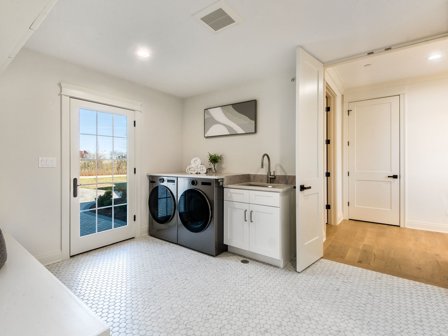 1 Morrison Road Northbrook, IL 60062 - Photo 18 of 58 a view of a hallway with washer and dryer