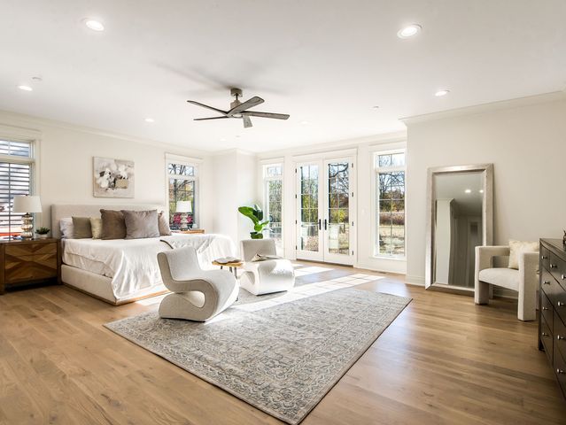 a bathroom with a double vanity sink toilet and shower