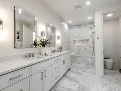 a white bath tub sitting in a bathroom