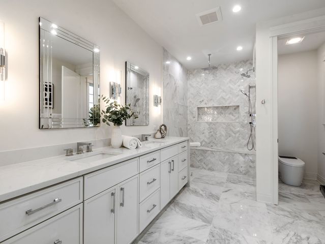 a white bath tub sitting in a bathroom