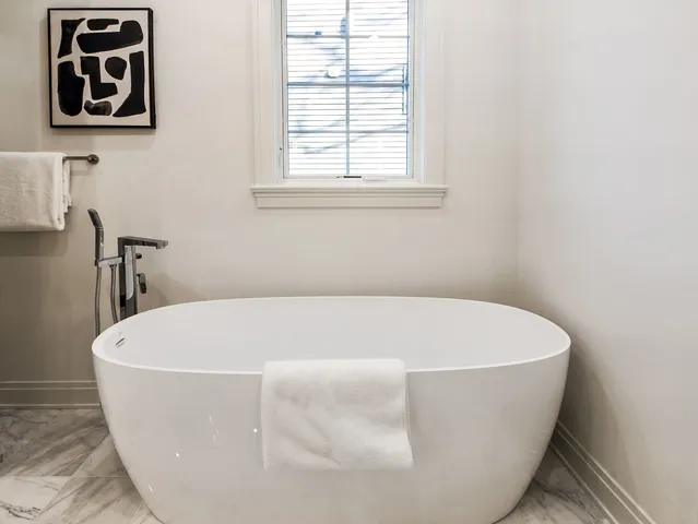 a view of entryway with wooden floor and a front door