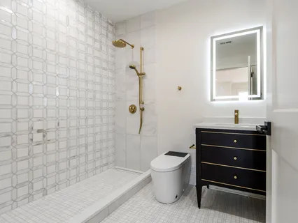 a spacious bedroom with a bed a couch and a window