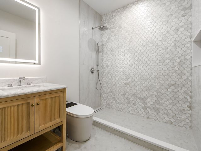 a utility room with sink dryer and washer