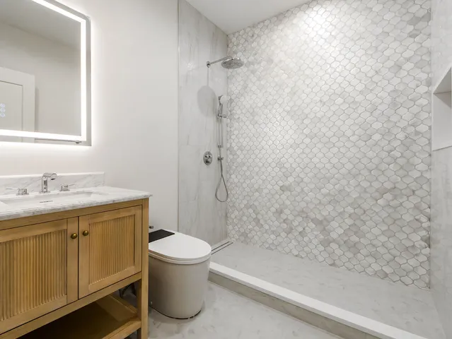 a utility room with sink dryer and washer
