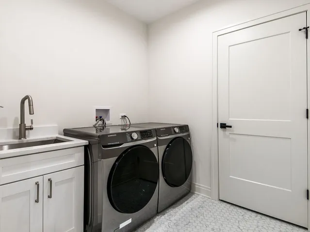 a kitchen with stainless steel appliances kitchen island granite countertop a sink stove and cabinets