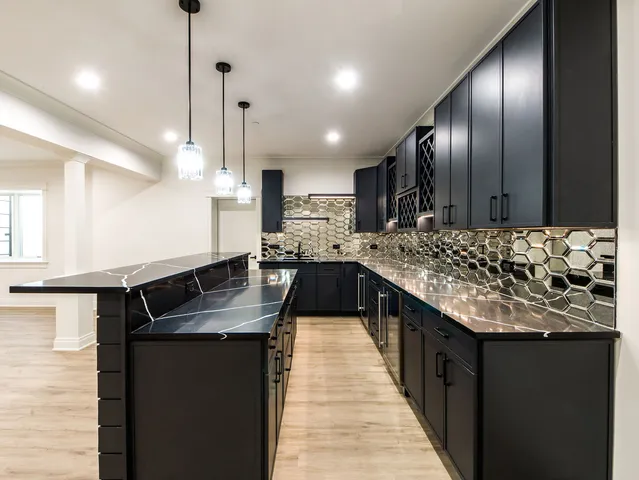 a spacious bedroom with a bed and a couch