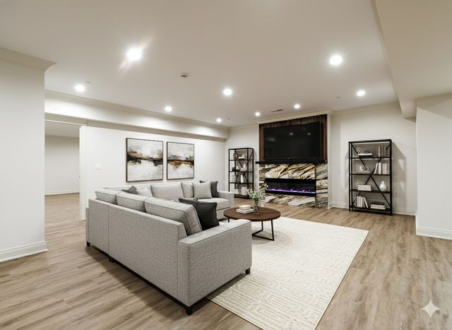 a bathroom with a granite countertop sink a toilet a mirror and shower