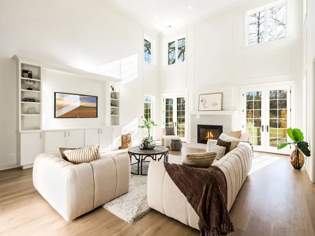 a dining room with furniture and wooden floor