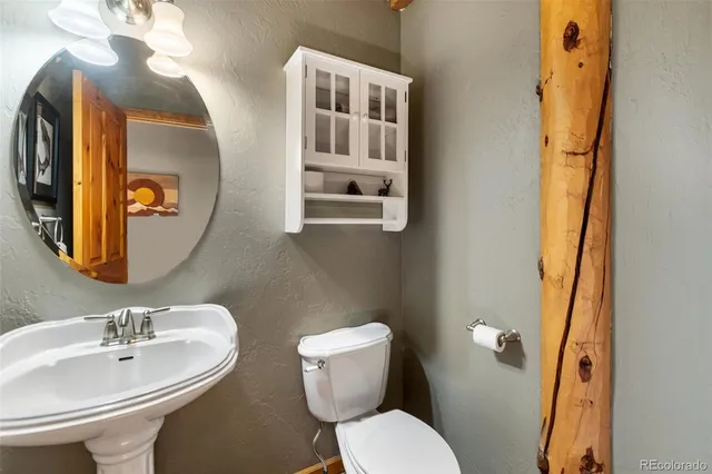 a bedroom with a bed and a table