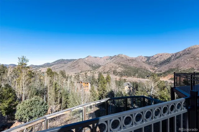 a view of a balcony with wooden fence and floor