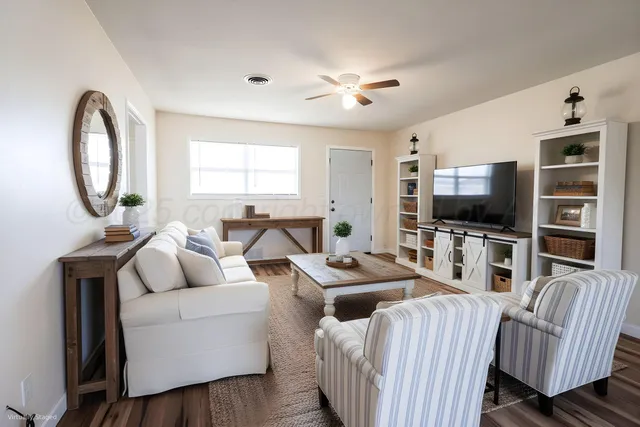 a living room with furniture and a flat screen tv