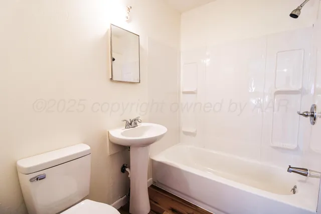 a bathroom with a sink toilet and bathtub