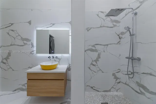 a bathroom with a tub and a sink