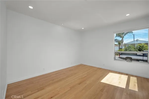 a view of an empty room and a window